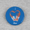 front view of blue colour badge or fridge magnet with i love chai printed on it